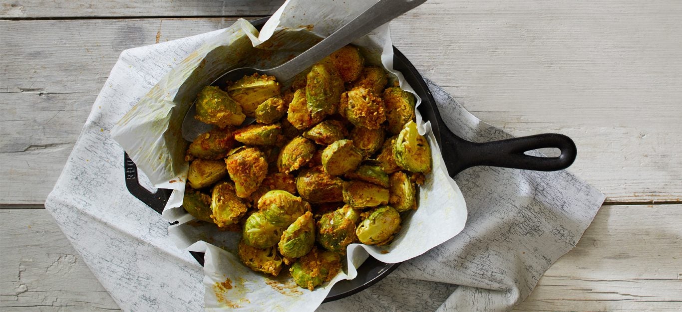 Spicy Roasted Brussels Sprouts in a cast iron skillet