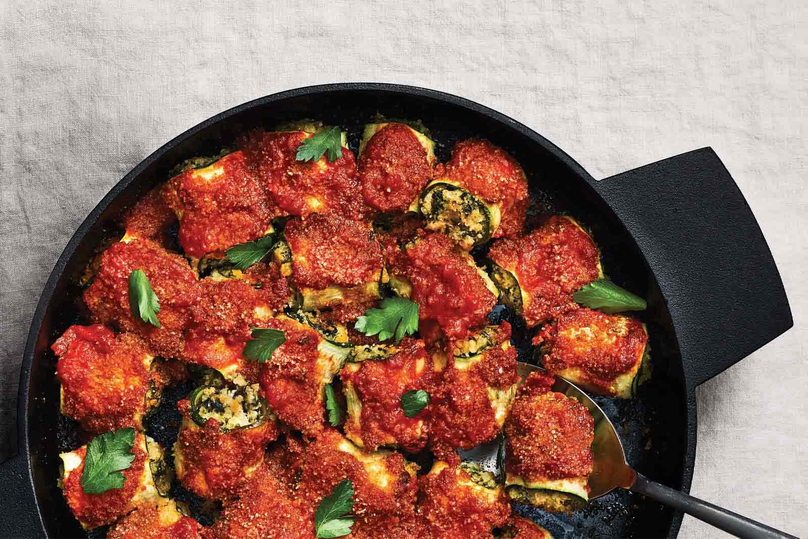 Zucchini Rollatini with Quinoa and Chickpeas in a cast iron skillet