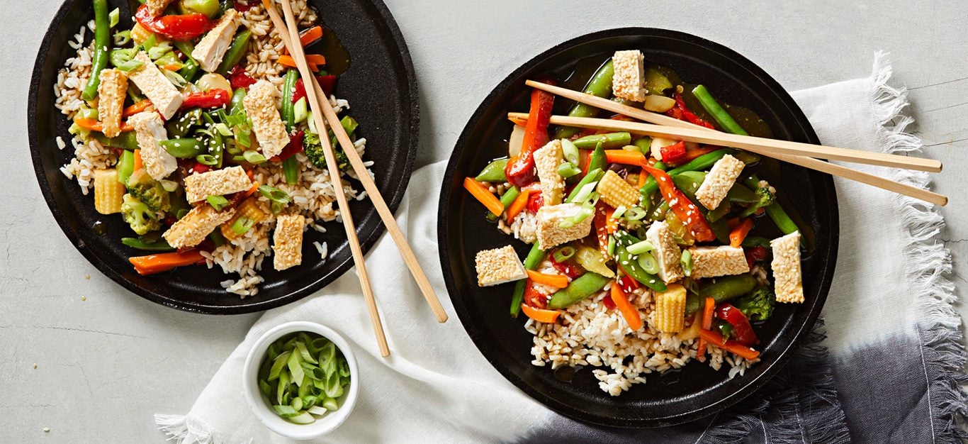 Air-Fryer Vegan Dish - Colorful Stir-Fry Dish with Veggies and Crispy Golden Sesame-Encrusted Tofu