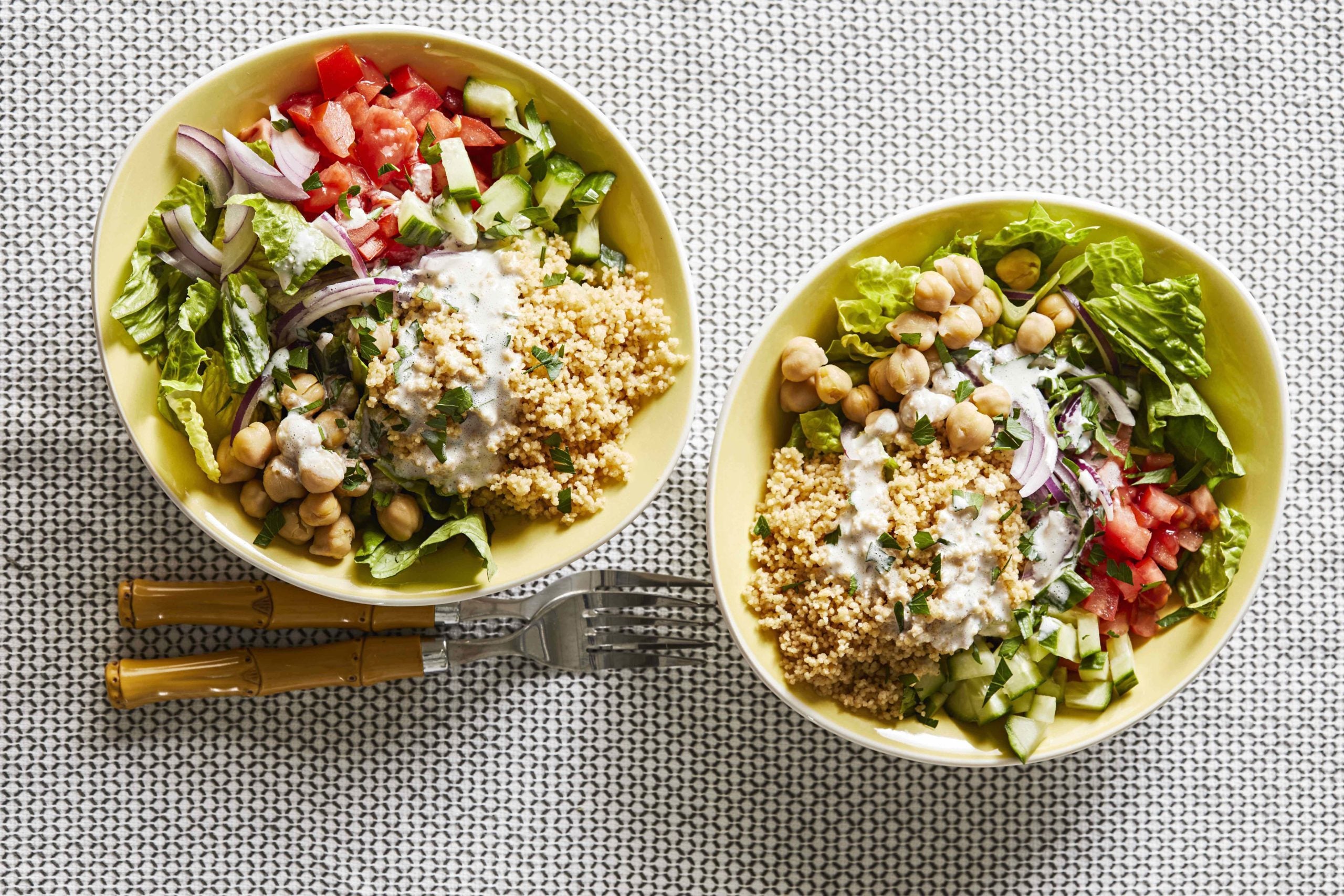 Top-down shot of two Couscous Bowls - one of our healthy 30-minute meals