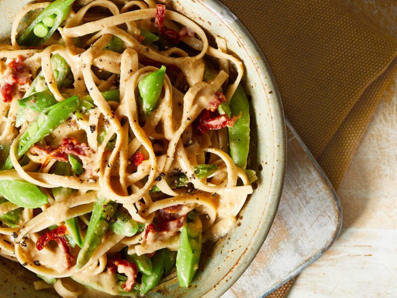 Vegan White Bean Fettuccine Alfredo with Peas and Sun-Dried Tomatoes