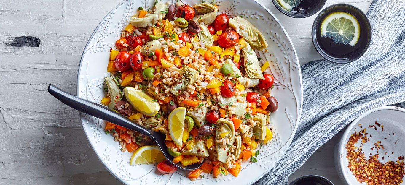 A Mediterranean farro grain salad with artichokes, tomatoes, and lemon