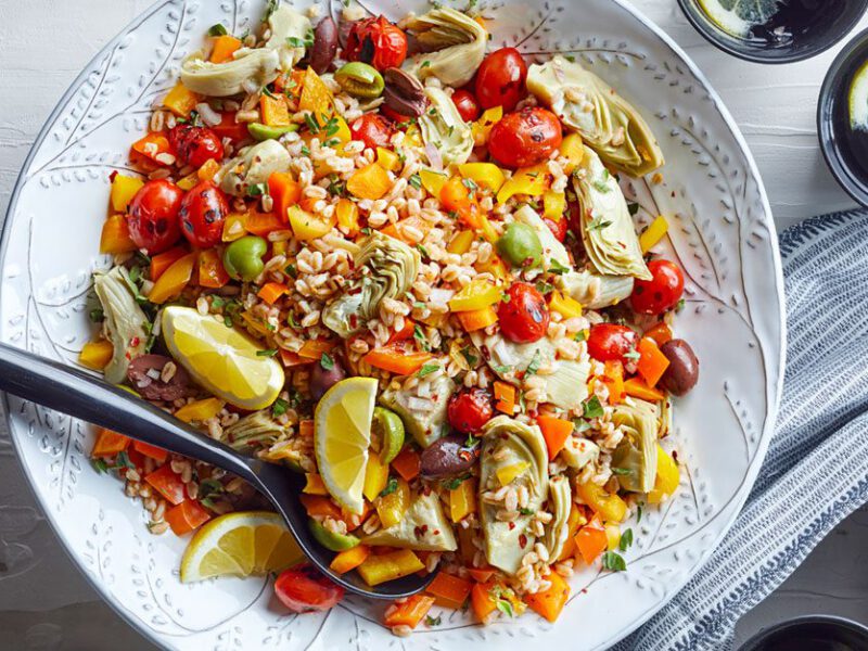 A Mediterranean farro grain salad with artichokes, tomatoes, and lemon