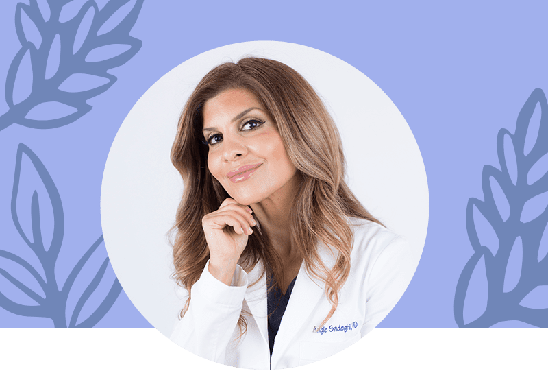 Headshot of a happy female doctor in a lab coat