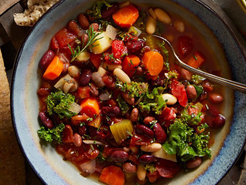 vegan cassoulet cooked in slow cooker with red beans, kidney beans, kale, carrots and more