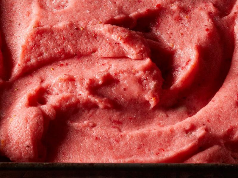 Close-up shot of red-pink strawberry-lemonade vegan ice cream