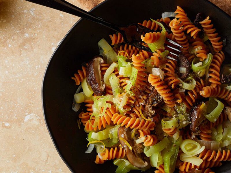 Red lentil rotini pasta with silken leeks and cooked dried shiitake mushrooms