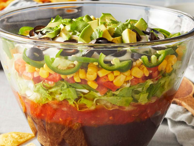 Vegan Mexican 10-Layer Dip Shown in Glass Bowl, which Reveals layers