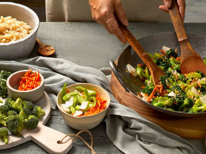 Table with stir-fry ingredients and equipment