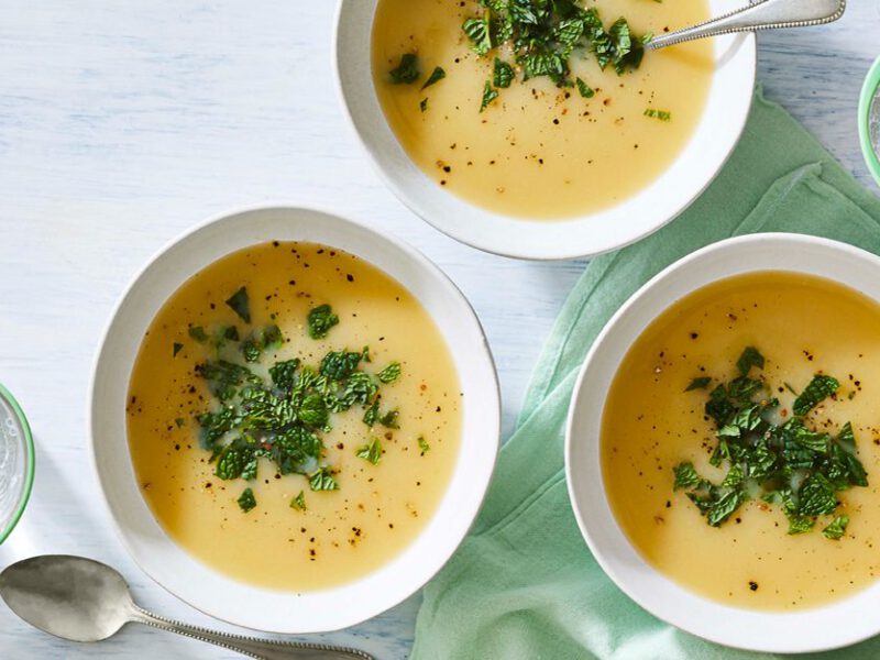Minted Vichyssoise soup in white bowls on a light gray countertop