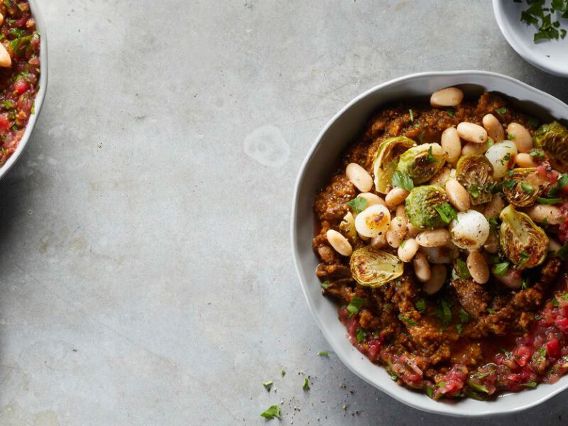 Baked Mushroom Polenta Bowls with white beans and brussels sprouts n a gray countertop