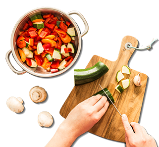 Woman prepping vegetables for Cooking Course