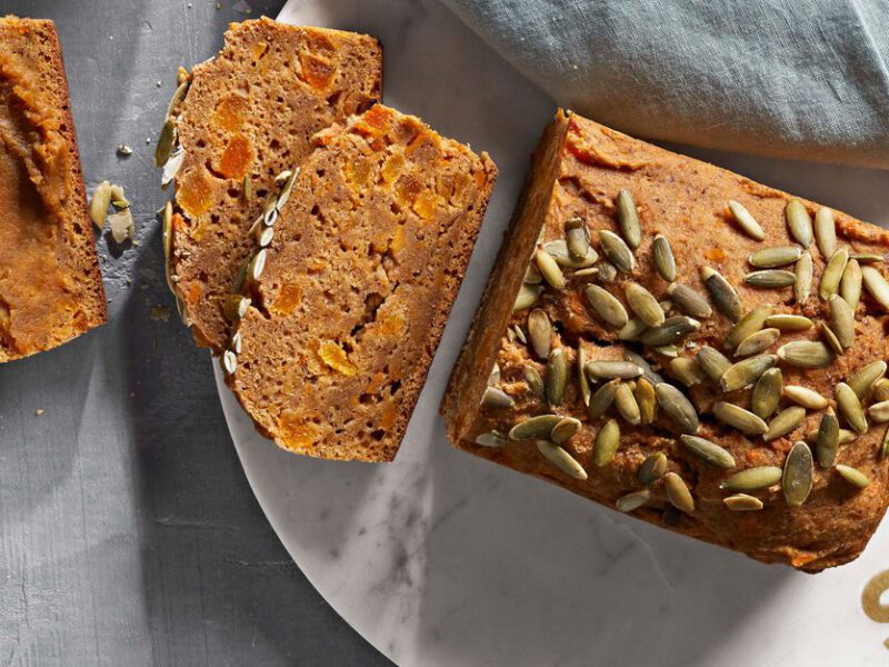 Sweet Potato Bread on a white marble plate that says "share" in gold letters