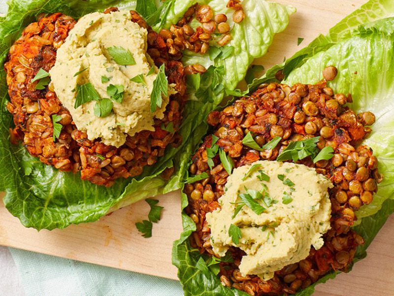 Lentil Burger Lettuce Wraps on a wood cutting board