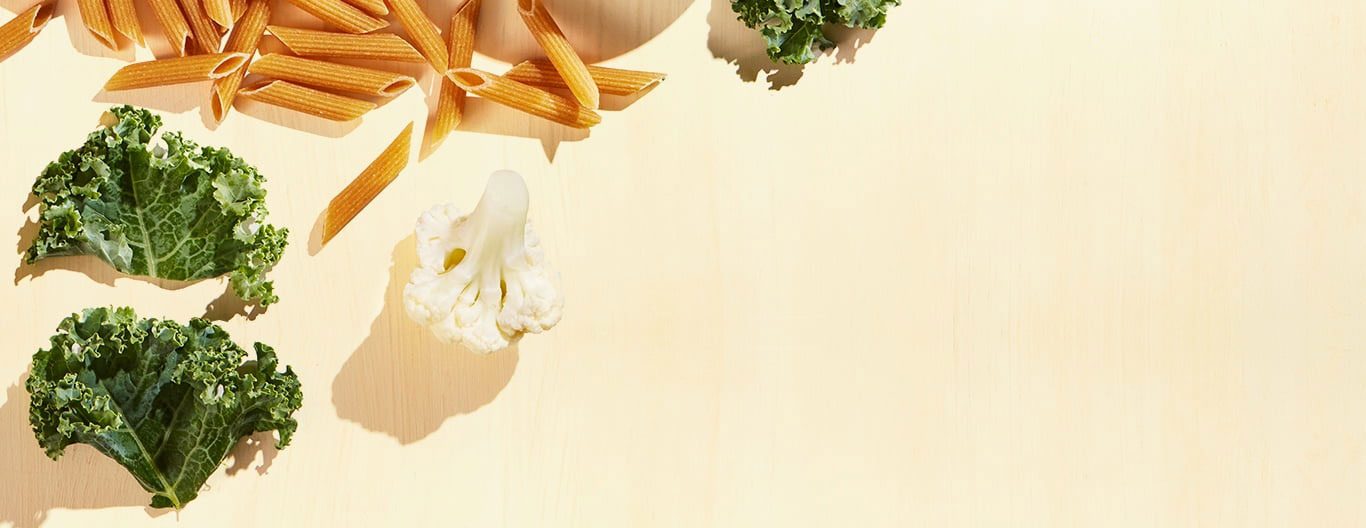 Broccoli, cauliflower and uncooked penne pasta