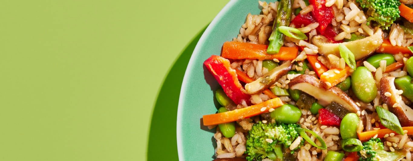 Image of sesame ginger frozen bowl on green background