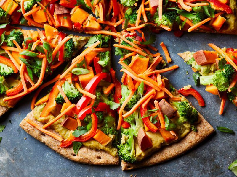Green Curry Thai Pizza on a concrete countertop
