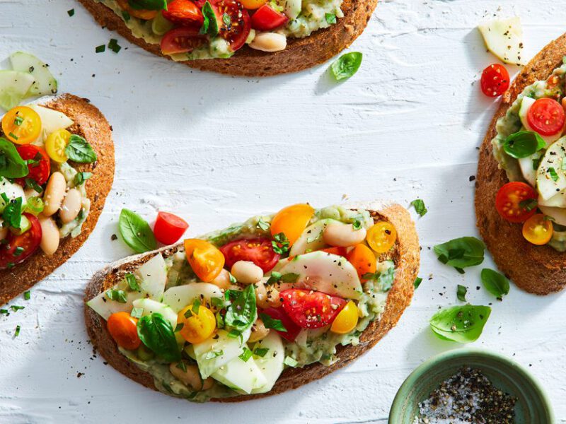 Cherry Tomato Bruschetta Tartines on a white countertop