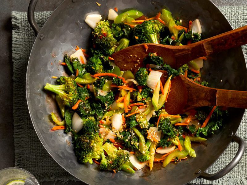 Ginger-Soy Veggie Stir-Fry in a wok with wooden serving spoons