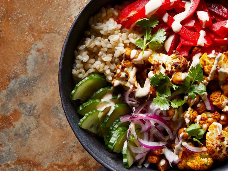 Vegan Shawarma with Roasted Cauliflower and Chickpeas in a gray bowl on stone counter