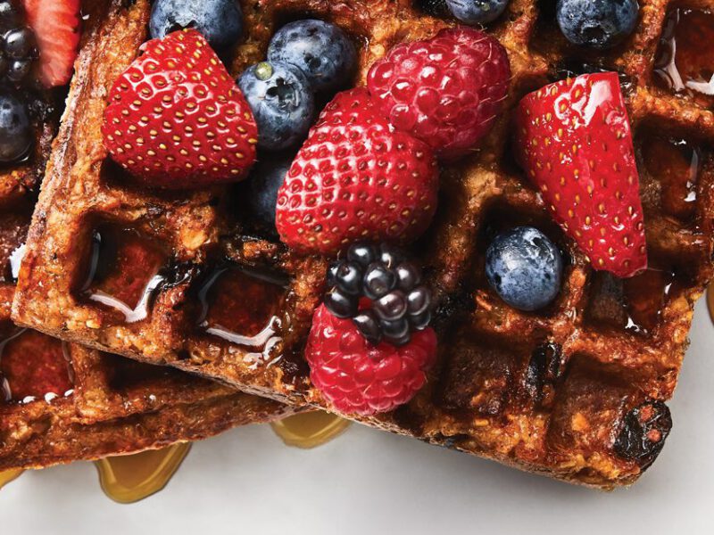 Waffled Maple-Cinnamon Oatmeal on a white plate with berries