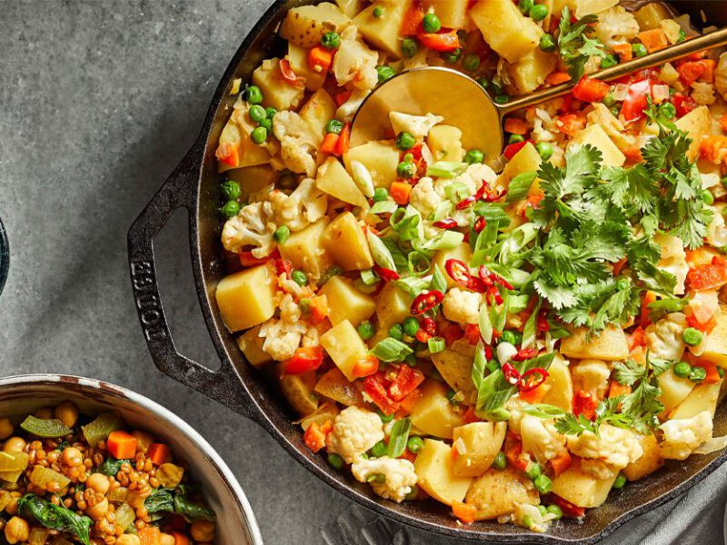Thai Green Curry Potato and Pea Breakfast Hash in a cast iron skillet