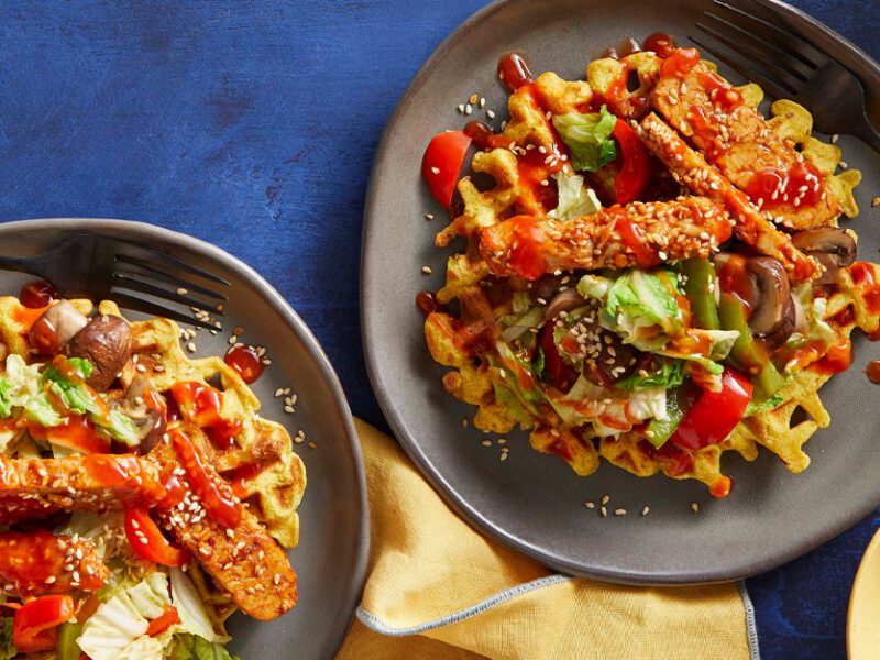 Vegan Korean-BBQ Waffles on grey plates on a blue table