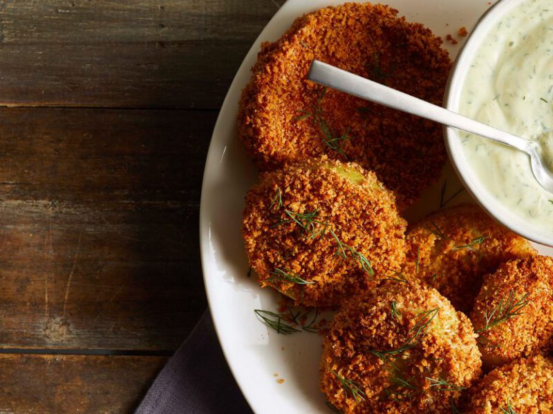 Air-Fried Green Tomatoes on a white plate with dipping sauce