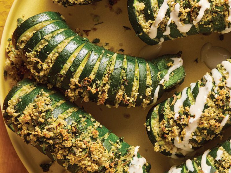 Hasselback Roasted Zucchini on a yellow plate and background