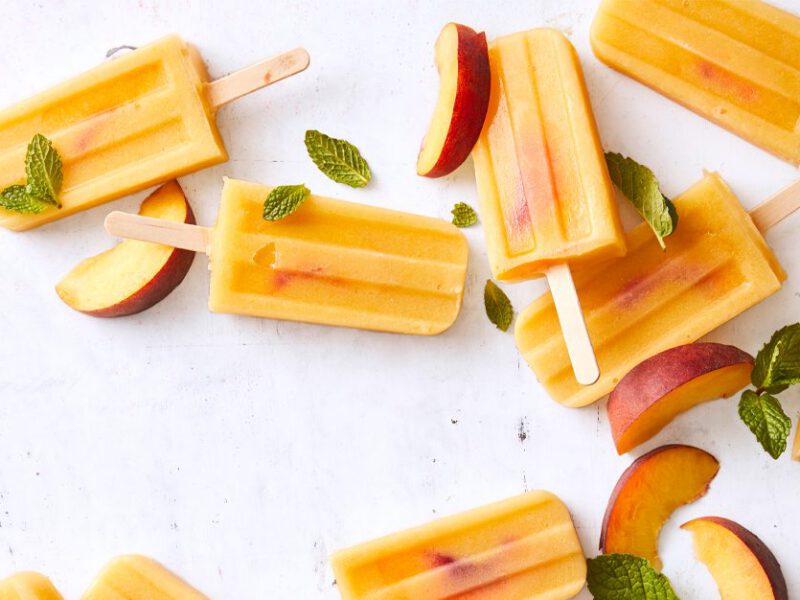 Vegan Peaches and Cream Ice Pops on a white countertop