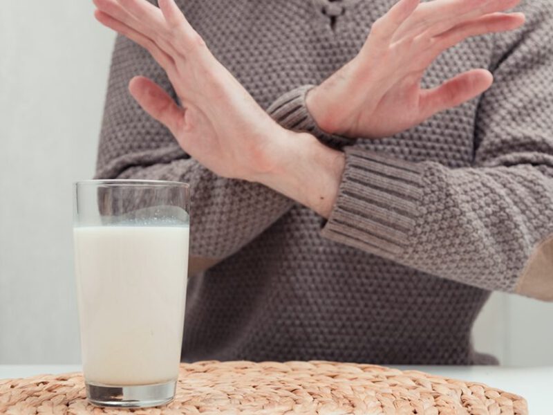 man refusing a glass of milk