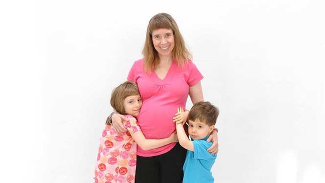 Lisa Silvius and her two children with a white background space