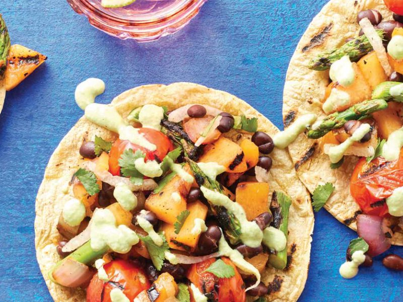 Grilled Melon and Black Bean Tostadas on a blue table