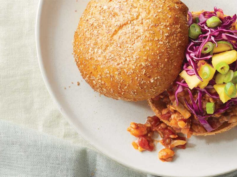 Tempeh BBQ Sandwiches with Pineapple Slaw on a white plate