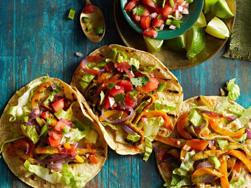 Grilled Nopales Tacos on a blue tabletop