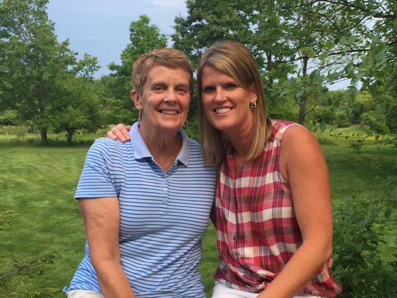 Mallory Taylor and her mother sit together outside, five years after her mother was diagnosed with cancer and adopted a plant-based diet