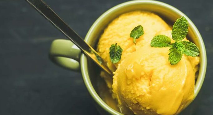 mango nice cream in a mug