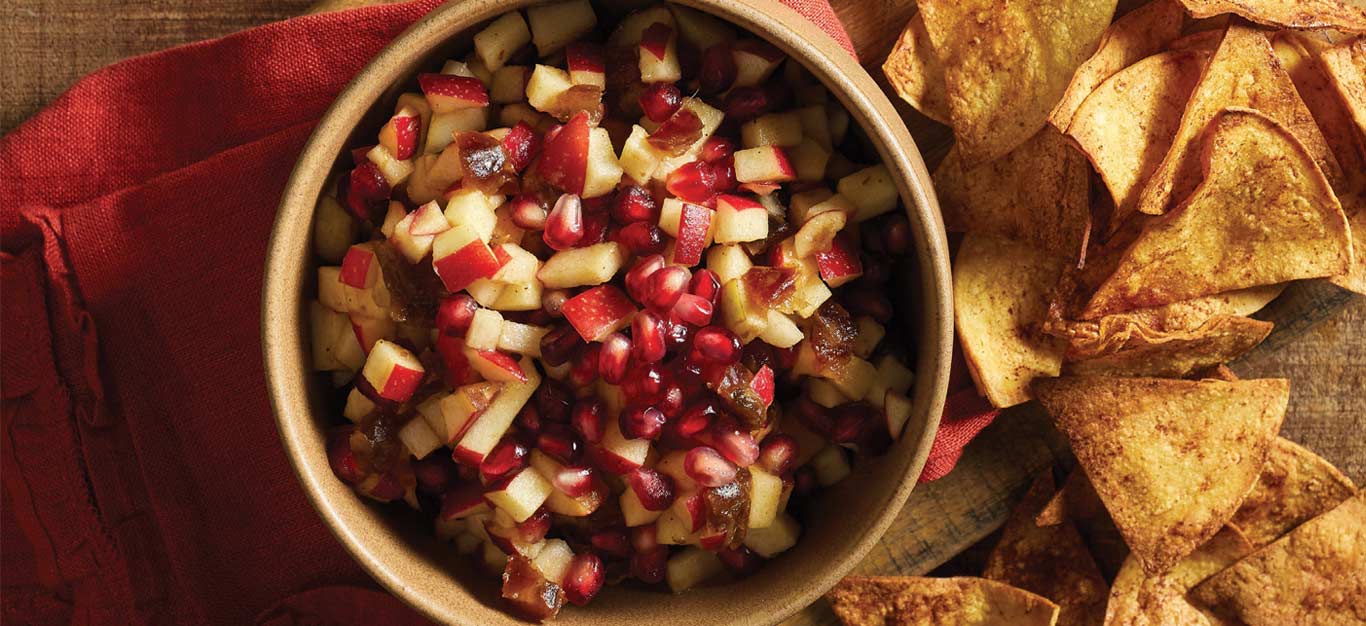 Apple Salsa with Cinnamon Tortilla Chips on a wood cutting board