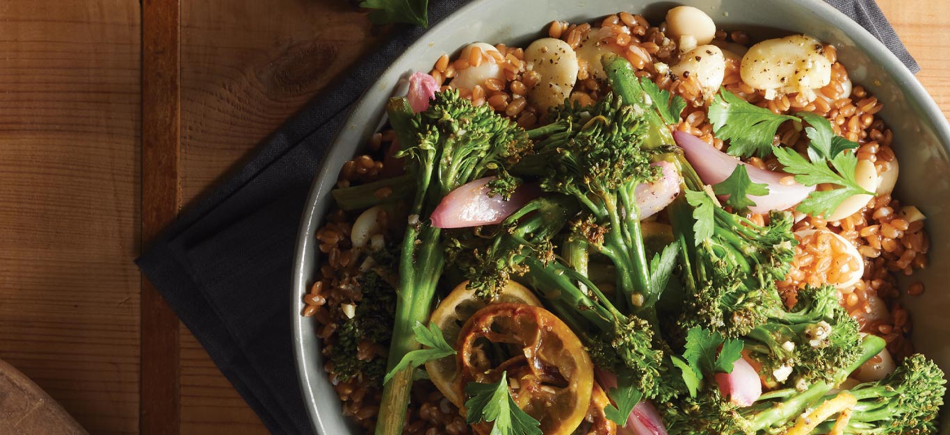 Lemony Spelt Salad with Roasted Broccolini in a shallow gray bowl