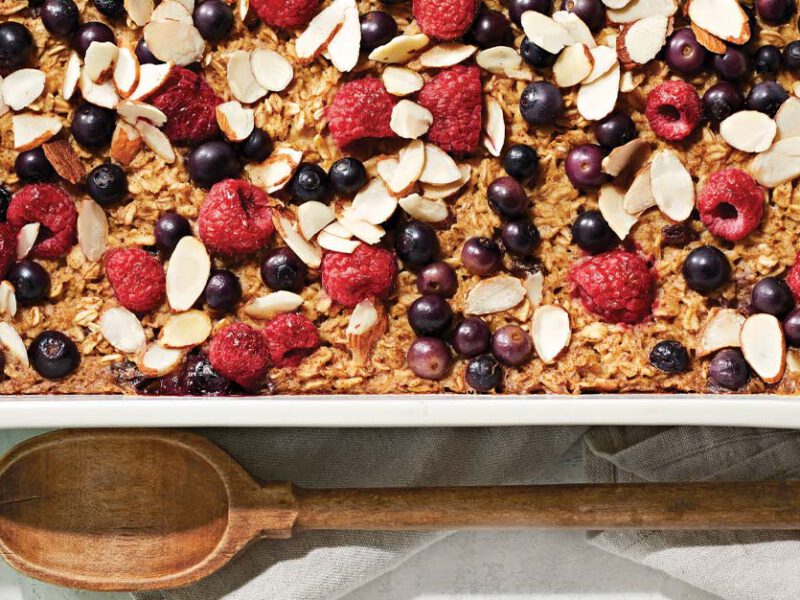 Oatmeal Breakfast Bake with Berries and Almonds in a white casserole dish