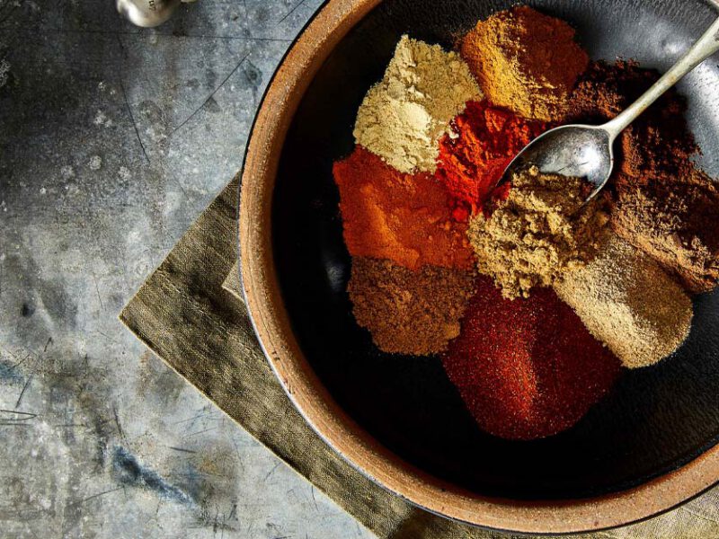 Homemade Berbere Spice Blend in a wooden bowl with a metal spoon