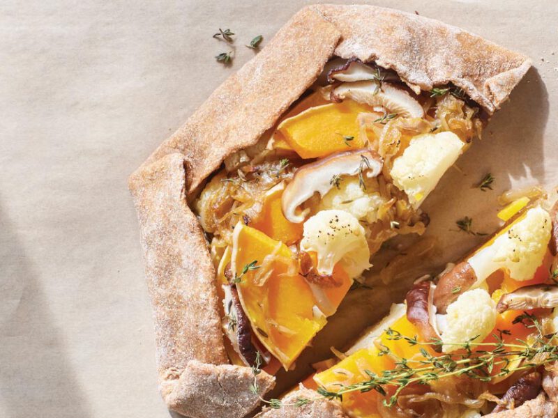 Vegan Galette with Caramelized Onion and Vegetables on parchment paper