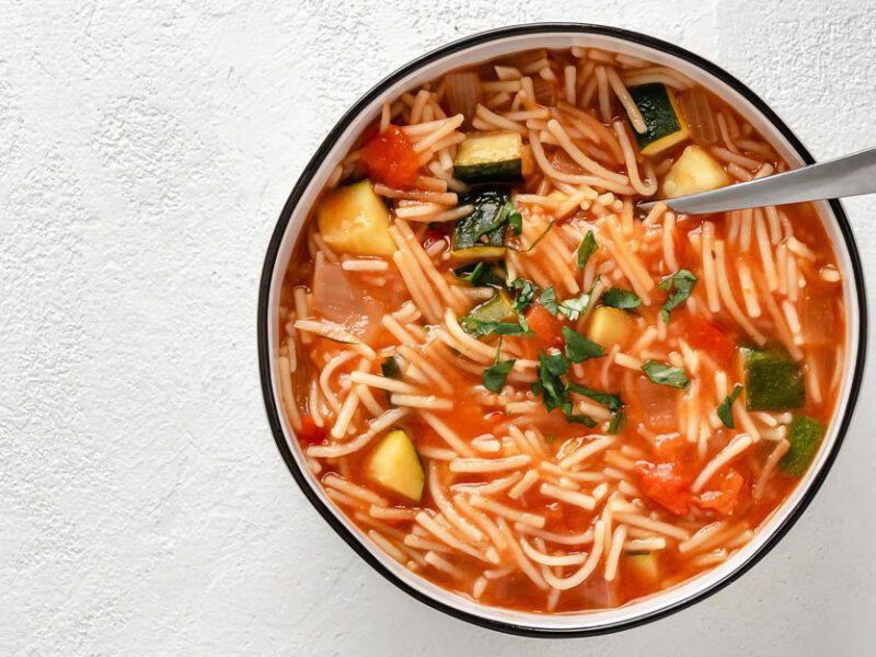 Toni Okamoto’s Sopa de Fideo in a white bowl against a gray background