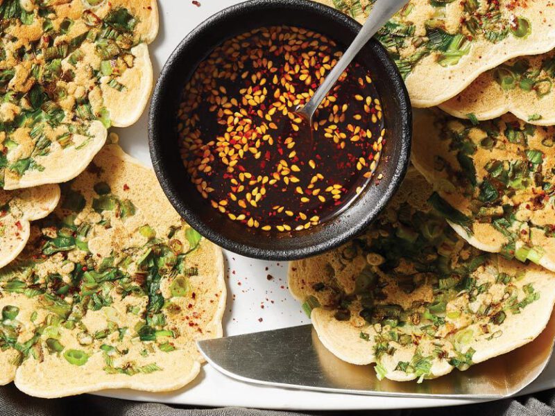 Oil-Free Scallion Pancakes with Spicy Soy Sauce on a white serving platter