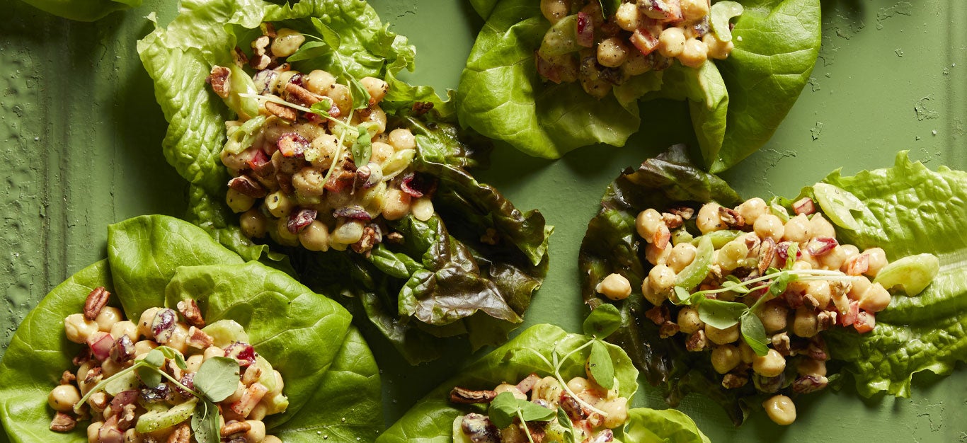 Curry Chickpea Lettuce Wraps on a green background