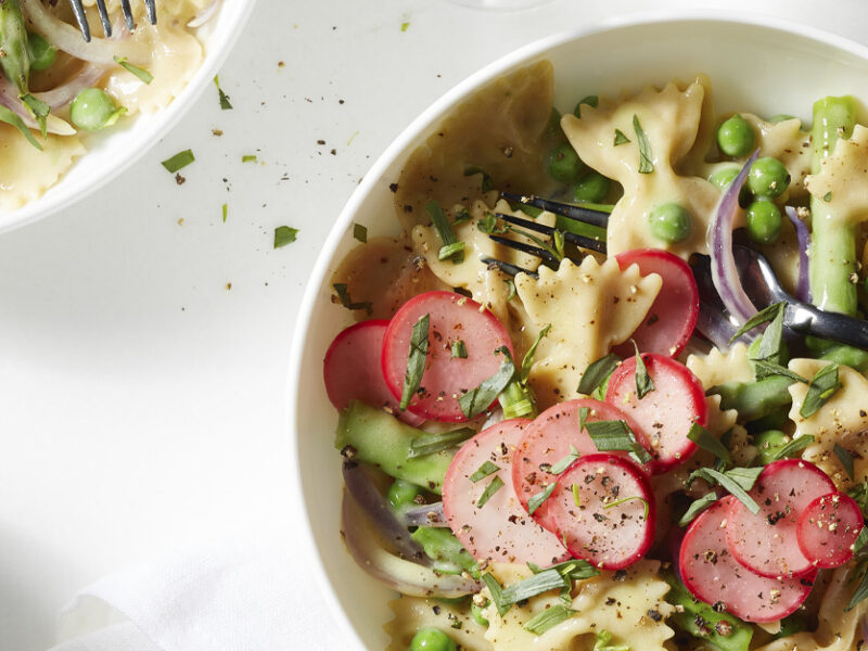 Spring Veggie Mac and Cheese with Vegan White Cheddar Sauce in white bowls