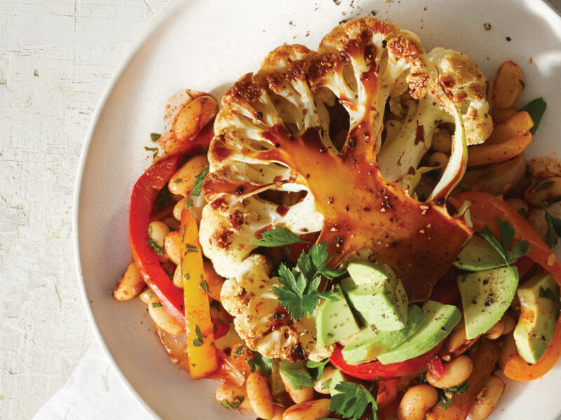 Roasted Cauliflower Planks with Pepper Salad on a white plate