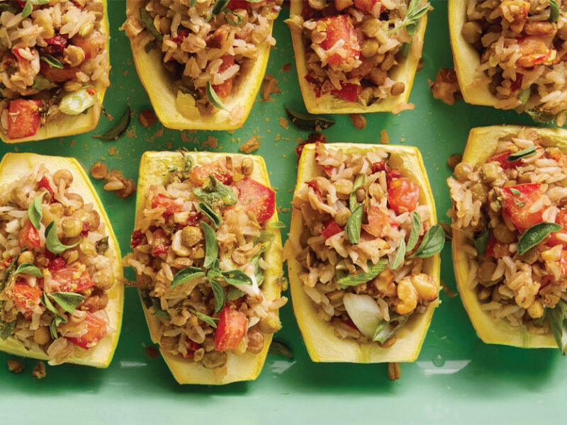 Summer Squash Boats with Lentil-Rice Stuffing on a mint green serving tray