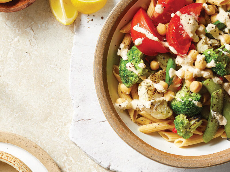 Summer Noodle Bowls with Grilled Veggies and Cashew Cream Sauce in white and tan ceramic bowls