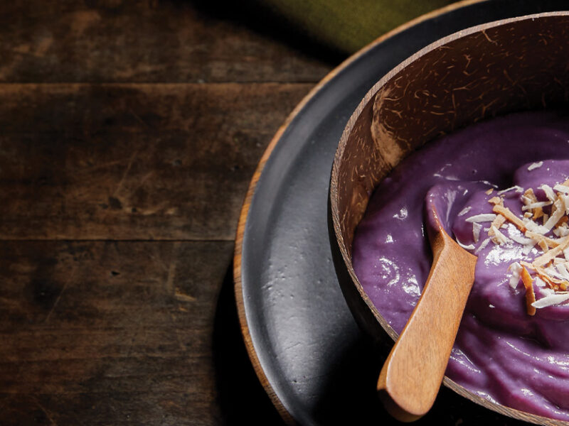 Vegan Ube Ice Cream in a wooden bowl with a wooden spoon